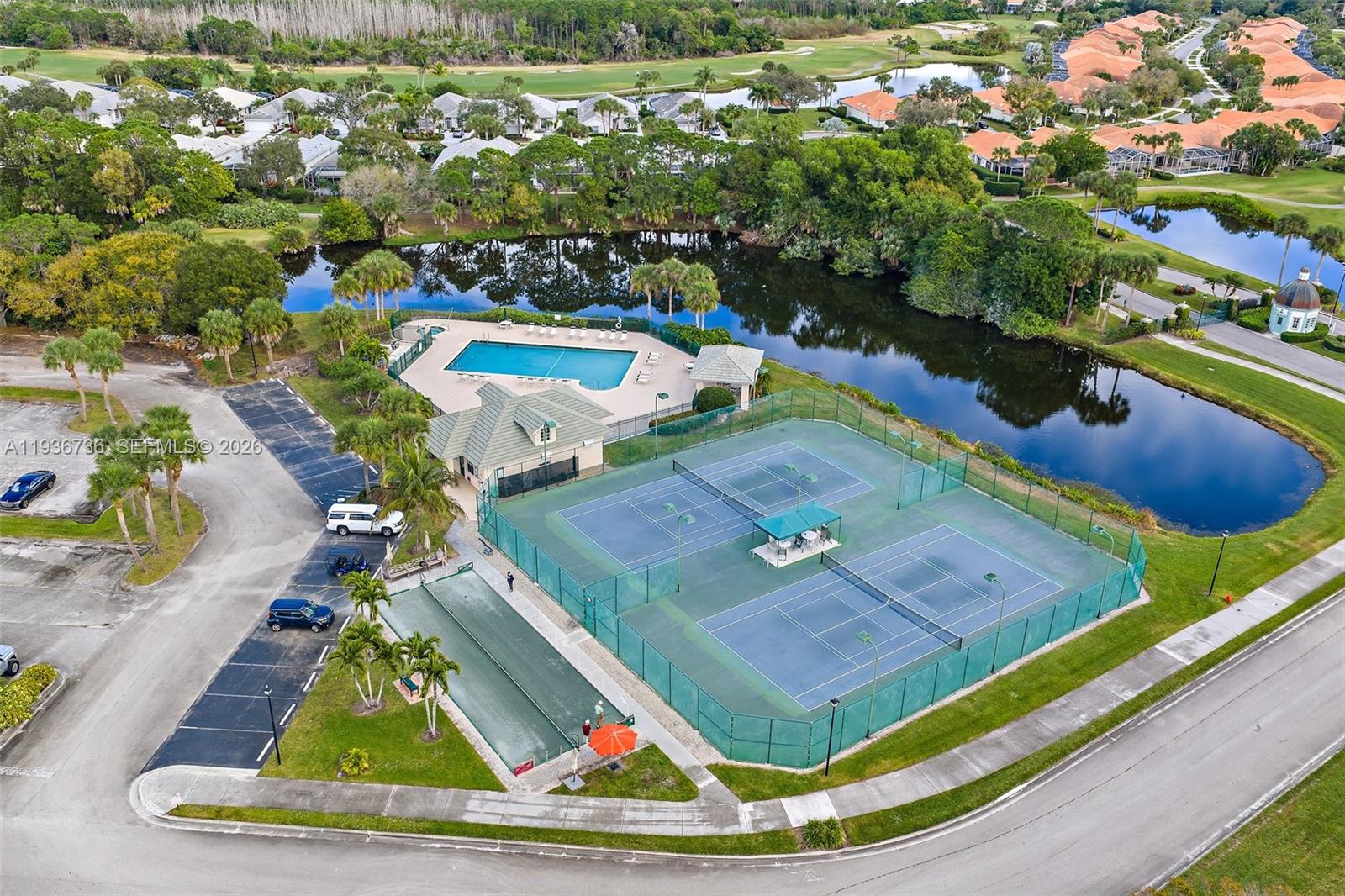 8185 Southeast Double Tree Drive Hobe Sound, FL 33455 - Photo 37 of 40 an aerial view of a pool yard patio and outdoor kitchen