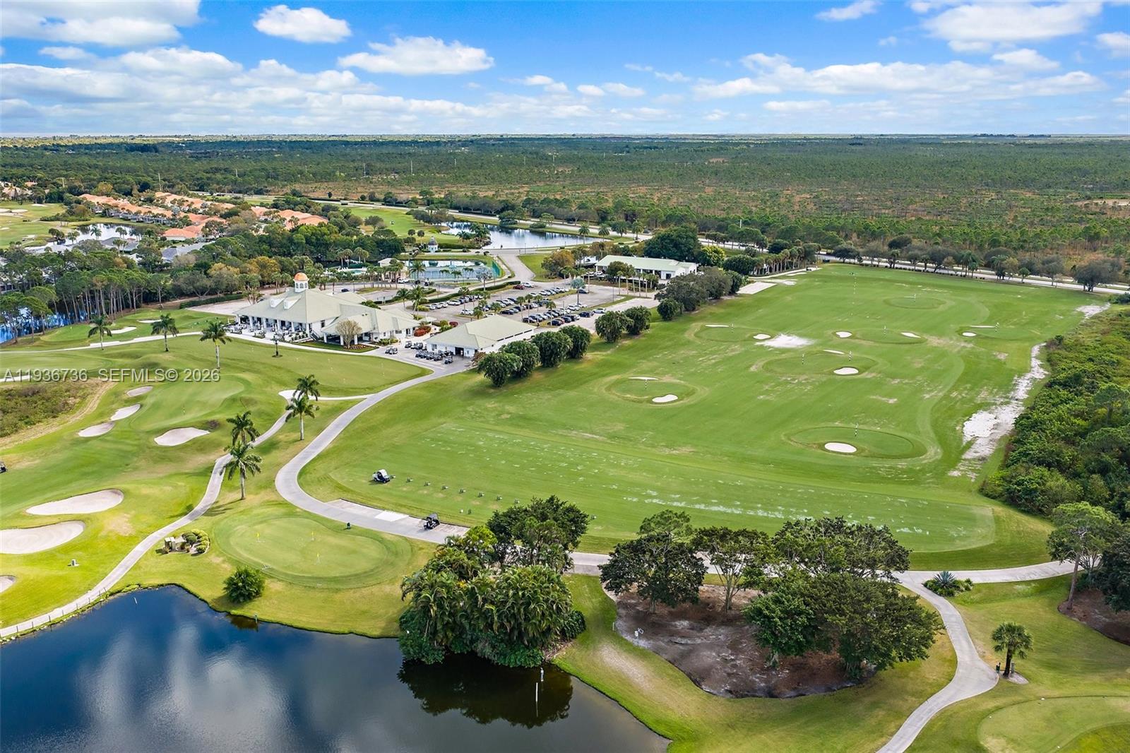 8185 Southeast Double Tree Drive Hobe Sound, FL 33455 - Photo 38 of 40 a view of a lake with a houses