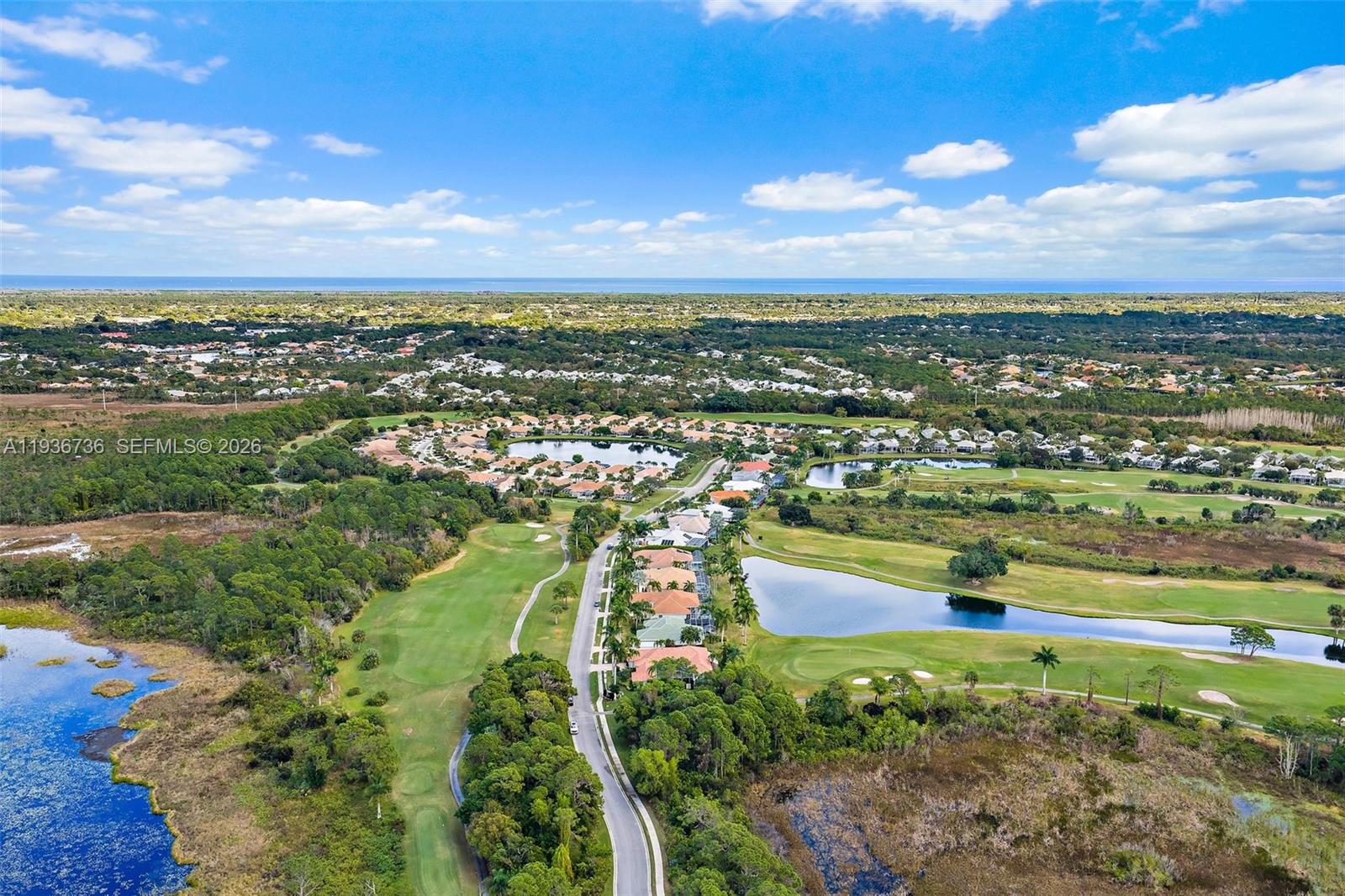 8185 Southeast Double Tree Drive Hobe Sound, FL 33455 - Photo 39 of 40 a view of a lake with a city