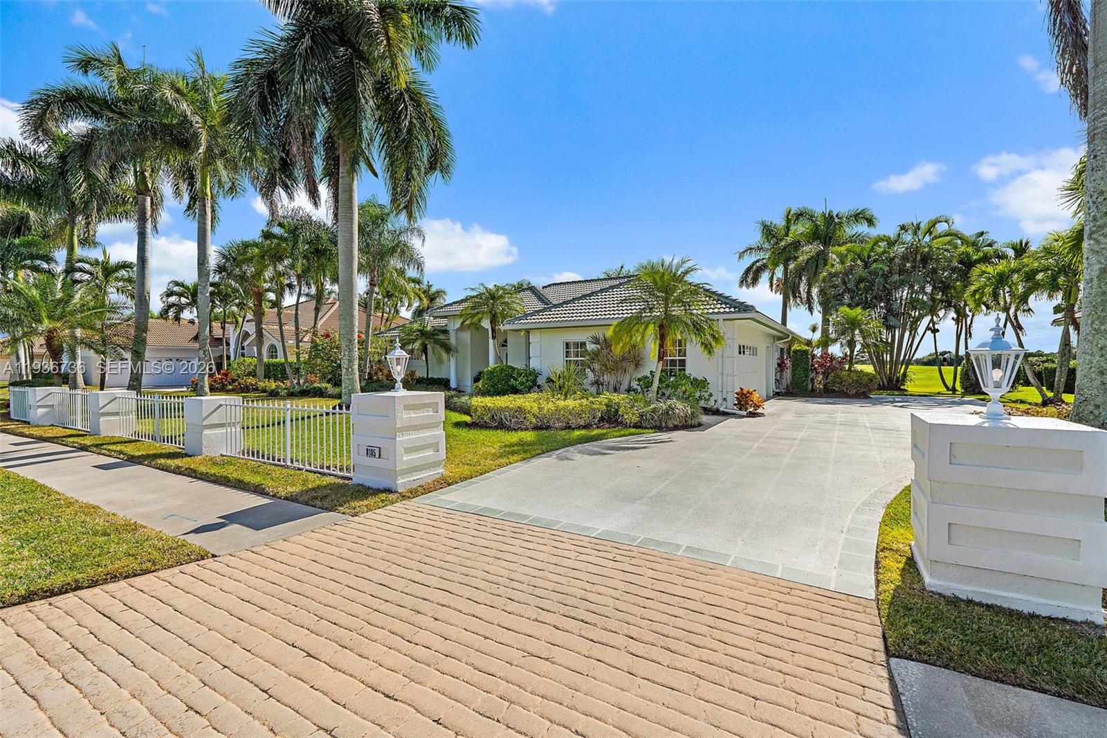 8185 Southeast Double Tree Drive Hobe Sound, FL 33455 - Photo 4 of 40 a view of a swimming pool with a patio