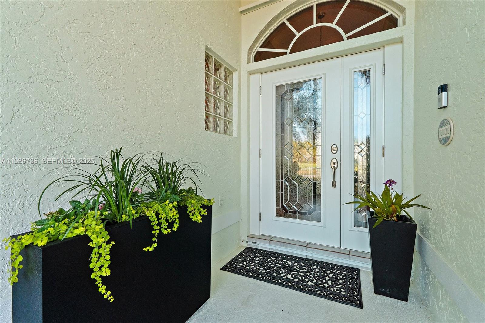 8185 Southeast Double Tree Drive Hobe Sound, FL 33455 - Photo 5 of 40 a view of a entryway door of the house