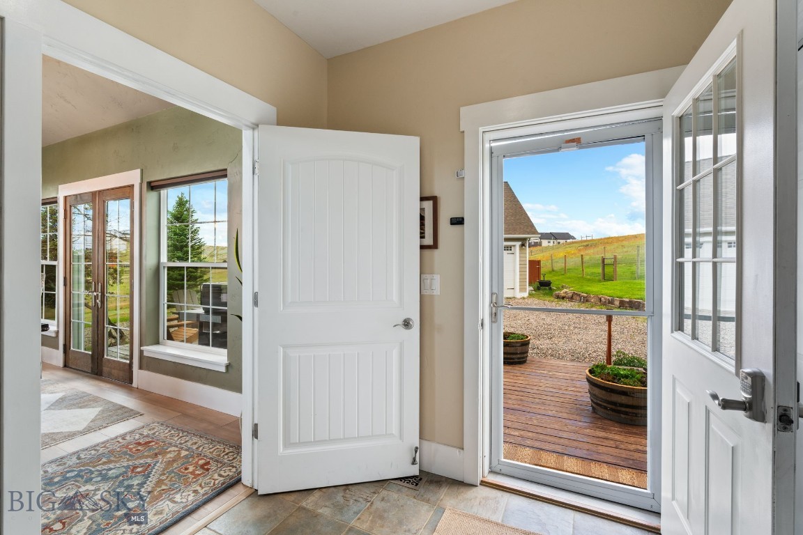 68 Rolling Glen Ranch Loop Three Forks, MT 59752 - Photo 3 of 48 Looking out the front door to the covered porch
