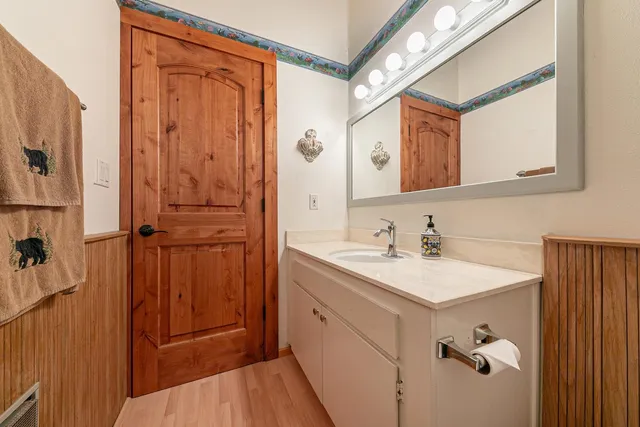 a bathroom with a sink a mirror and a shower