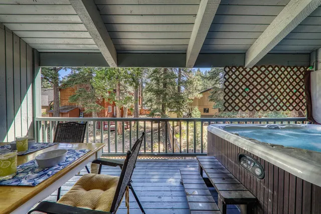 a view of balcony with wooden floor