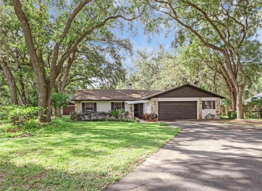 4308 Allen Road Fruitland Park, FL 34731 - Photo 1 of 33 a front view of a house with a garden