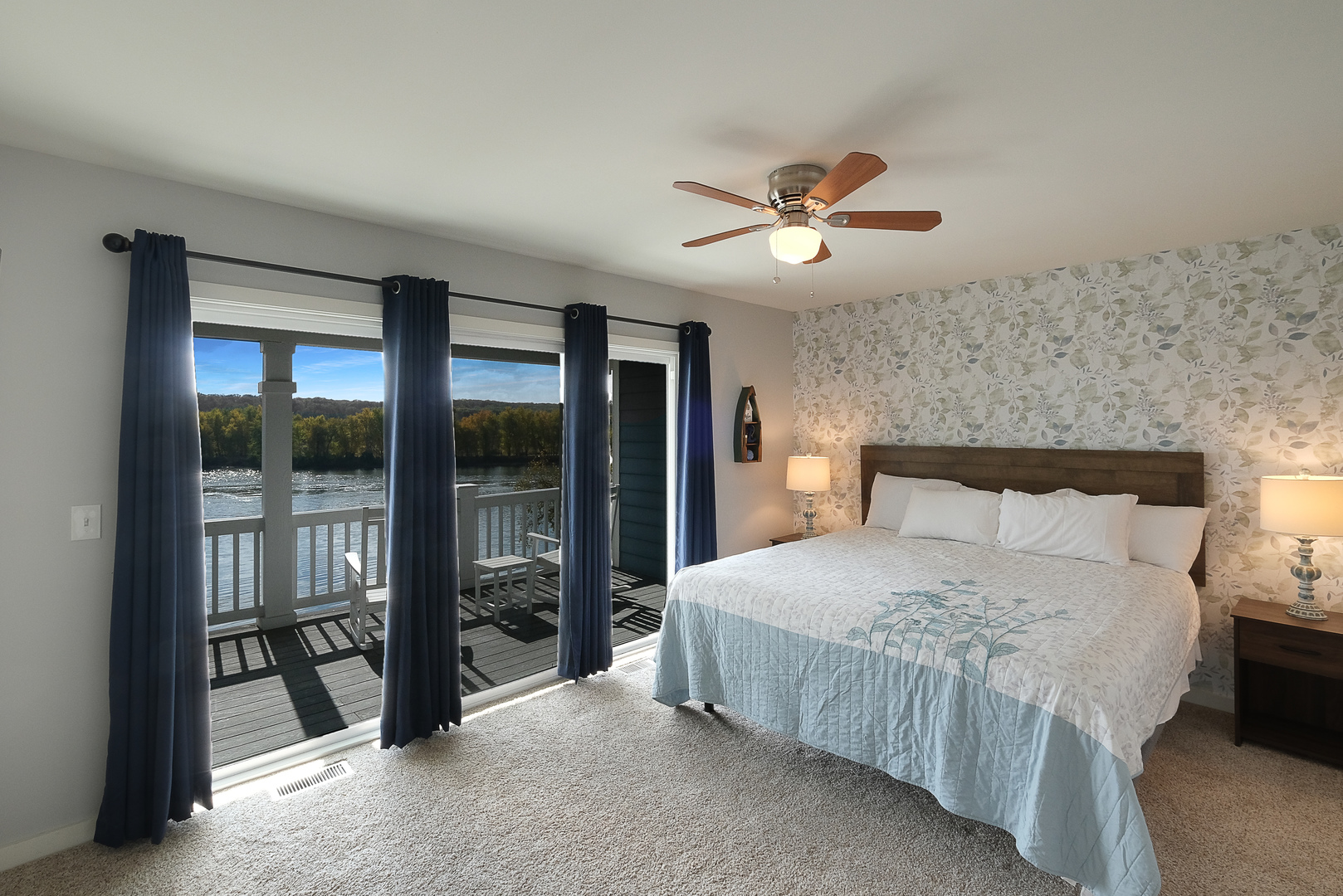 5 River Row Ottawa, IL 61350 - Photo 13 of 37 a bedroom with a large bed and a chandelier fan