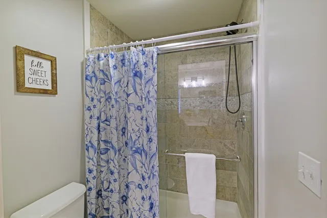 a bathroom with a shower and a sink