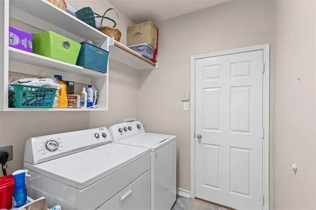 a utility room with dryer and washer
