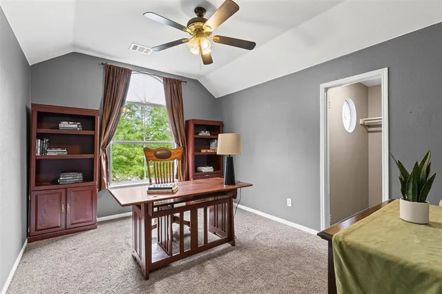 a view of backyard with outdoor seating and plants