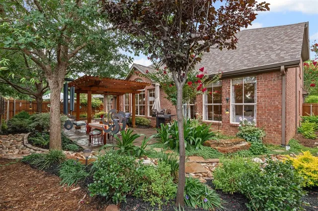 a view of a backyard with sitting area and furniture