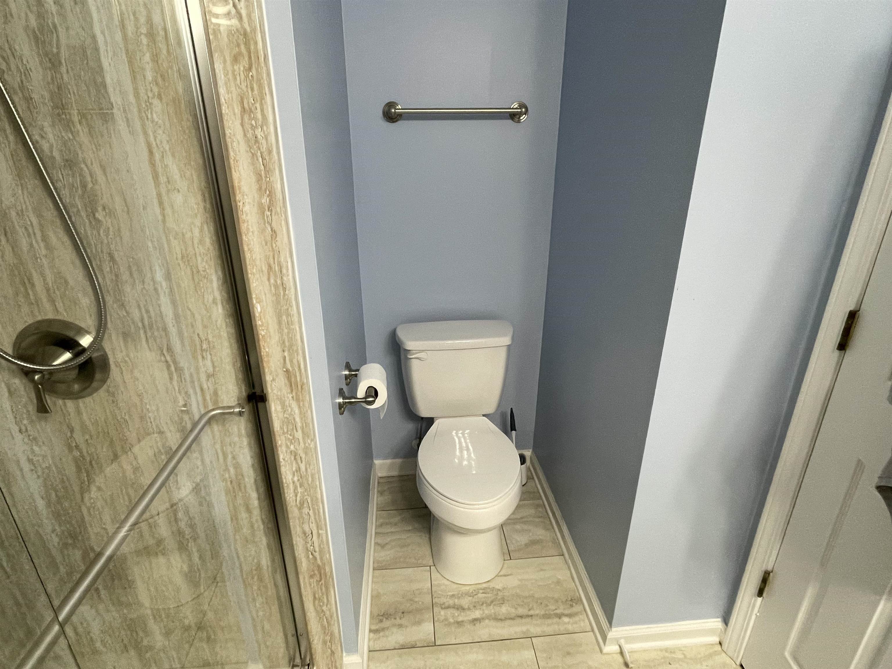 505 Night Heron Court Murrells Inlet, SC 29576 - Photo 15 of 27 Full bathroom featuring toilet and a shower stall