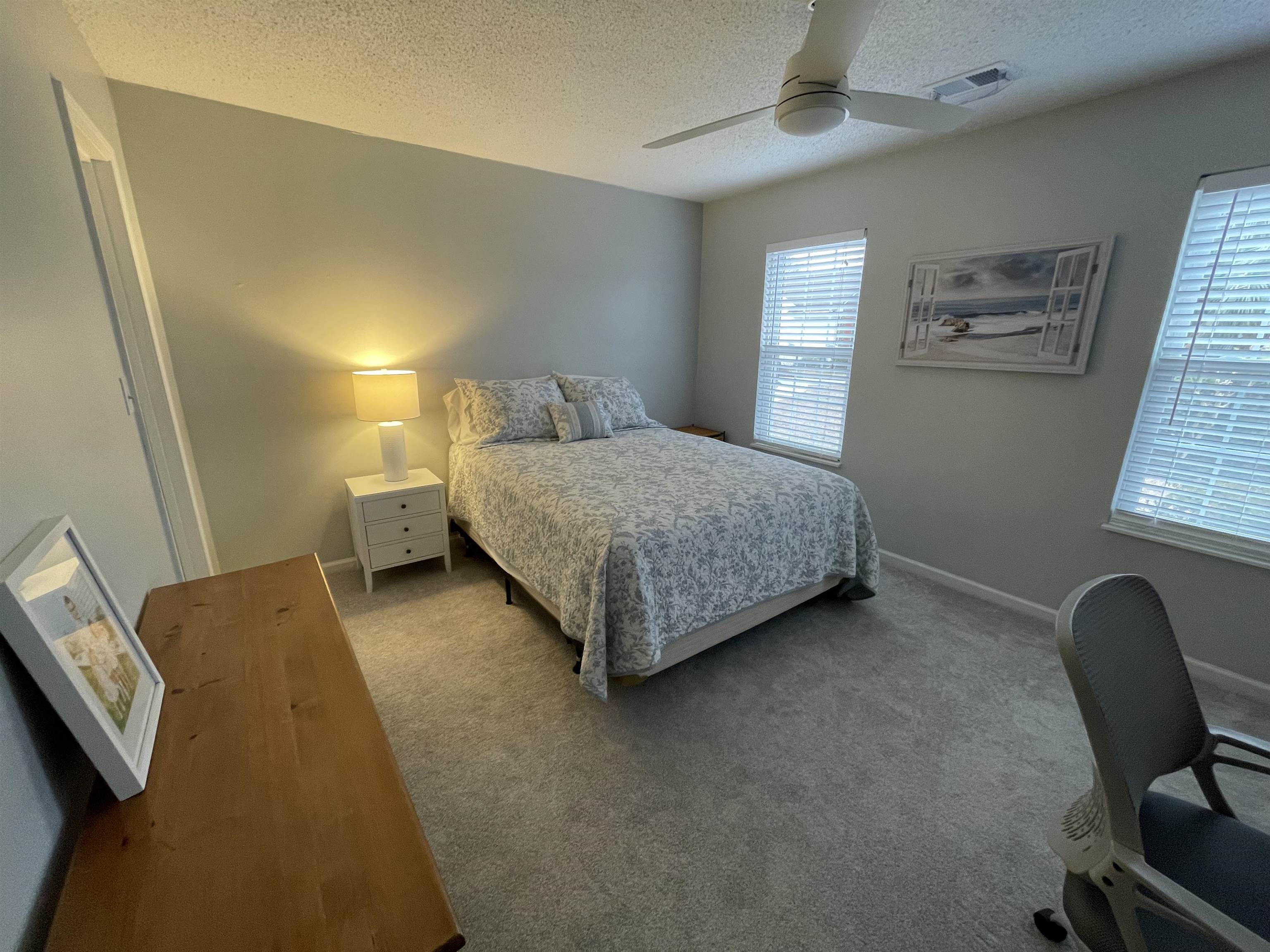 505 Night Heron Court Murrells Inlet, SC 29576 - Photo 18 of 27 Bedroom featuring a textured ceiling, a ceiling fan, and carpet floors