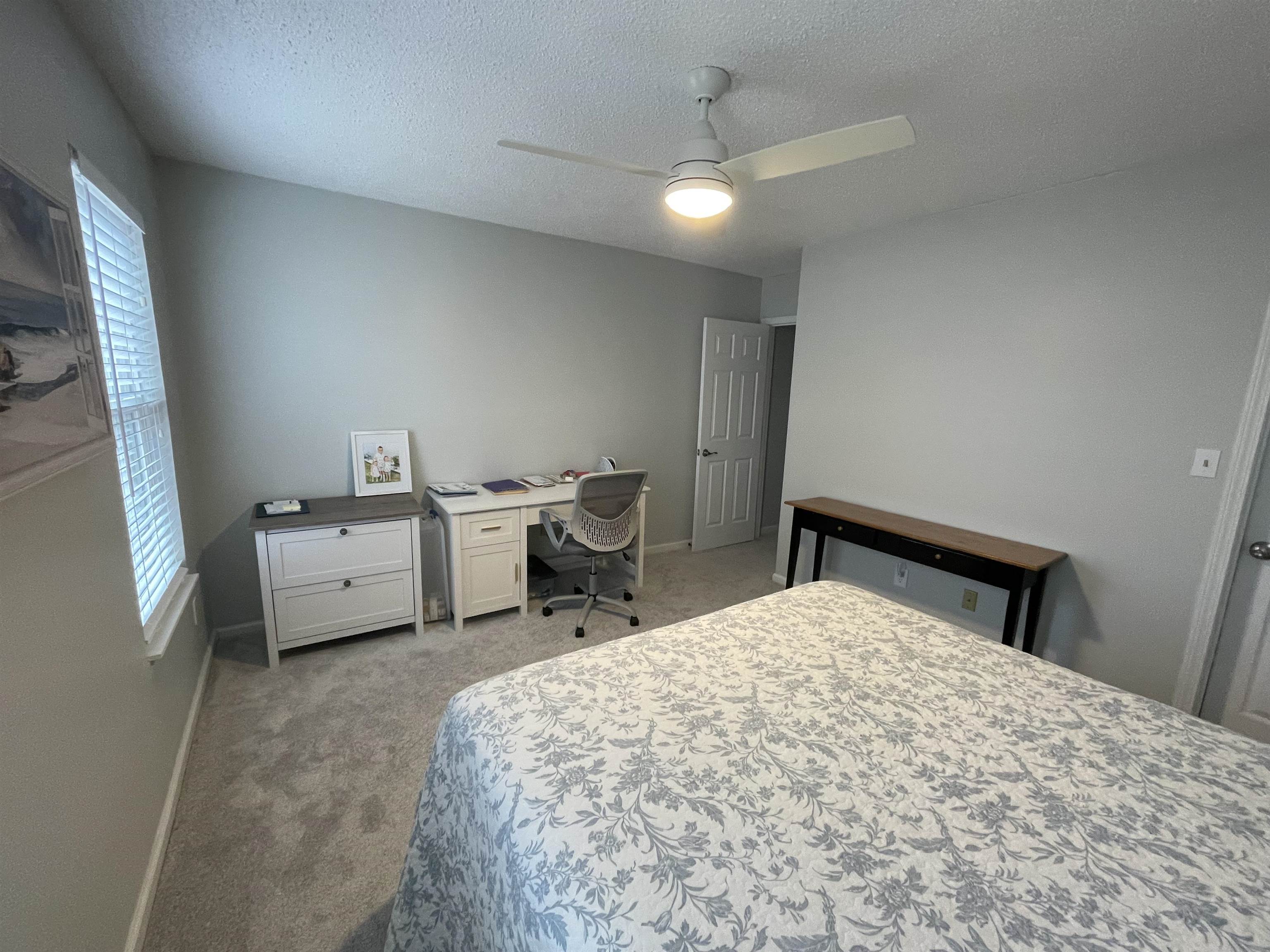 505 Night Heron Court Murrells Inlet, SC 29576 - Photo 19 of 27 Bedroom with light carpet, a textured ceiling, ceiling fan, and an office area