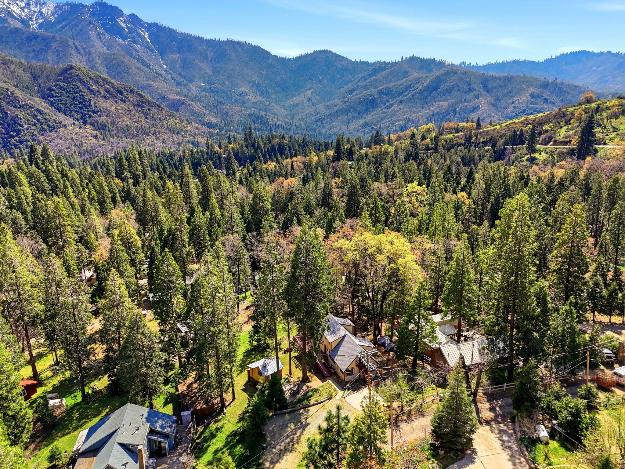 697 Loop Drive Springville, CA 93265 - Photo 49 of 55 a view of a houses with a lush green hillside