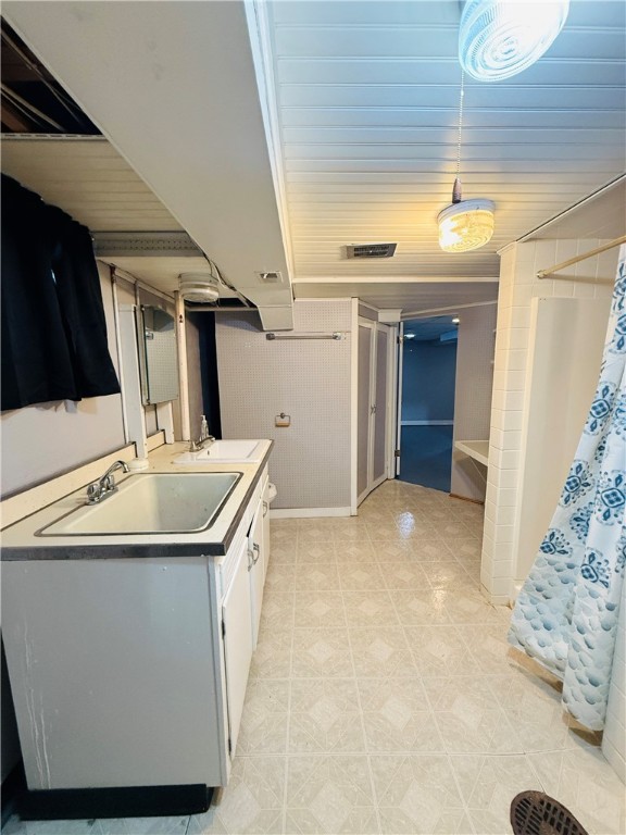 56 Maple Court Decatur, IL 62526 - Photo 25 of 31 a bathroom with a sink and a mirror