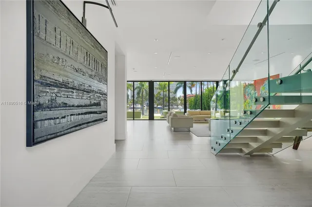 a view of an entryway with floor to ceiling windows