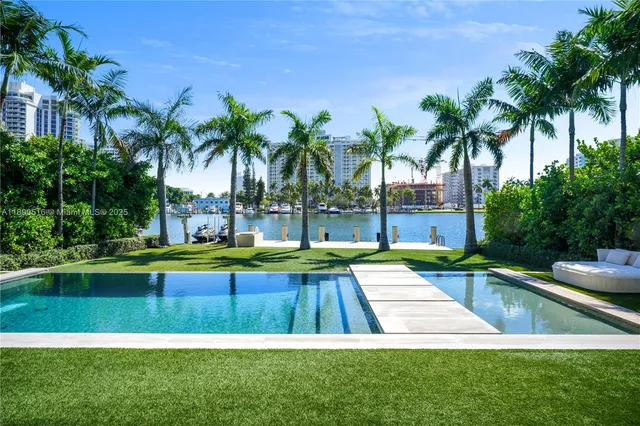 a view of swimming pool with a yard