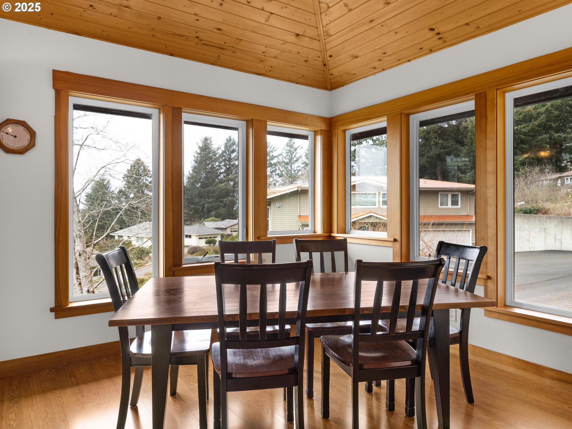 8435 Treasure Rocks Road Nehalem, OR 97131 - Photo 15 of 41 a view of a dining room with furniture window and wooden floor