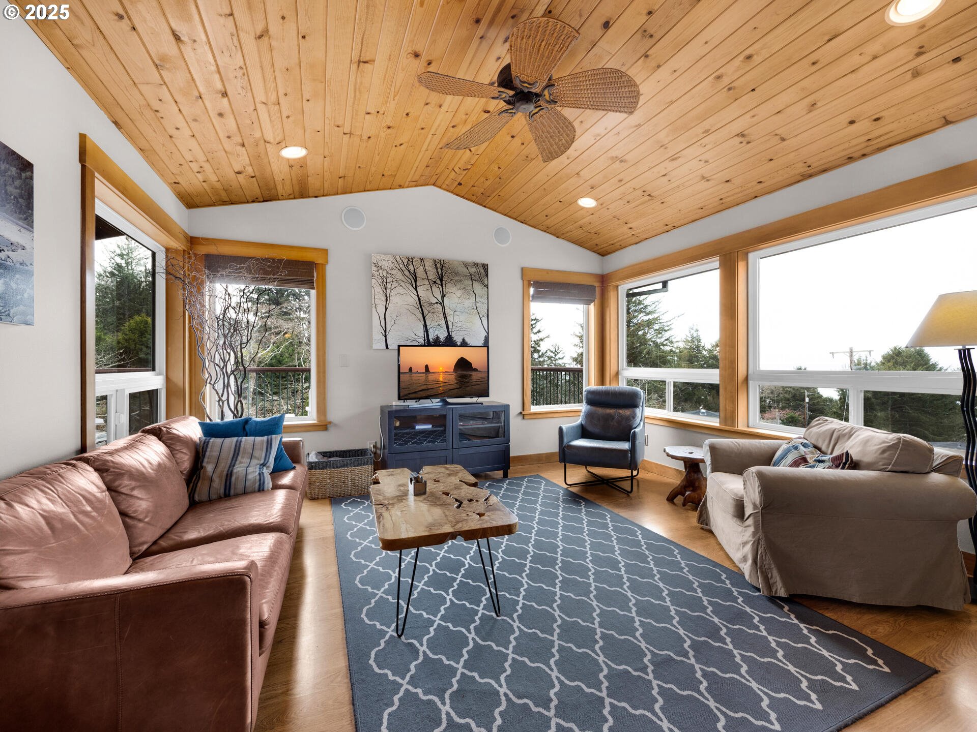8435 Treasure Rocks Road Nehalem, OR 97131 - Photo 16 of 41 a living room with furniture and a large window