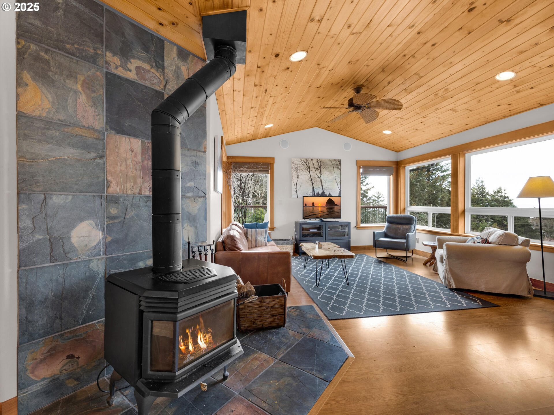 8435 Treasure Rocks Road Nehalem, OR 97131 - Photo 17 of 41 a living room with furniture and a fireplace