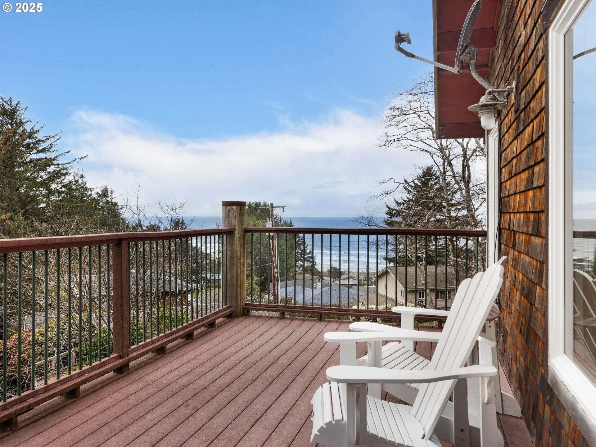 8435 Treasure Rocks Road Nehalem, OR 97131 - Photo 19 of 41 a view of balcony with wooden floor and fence
