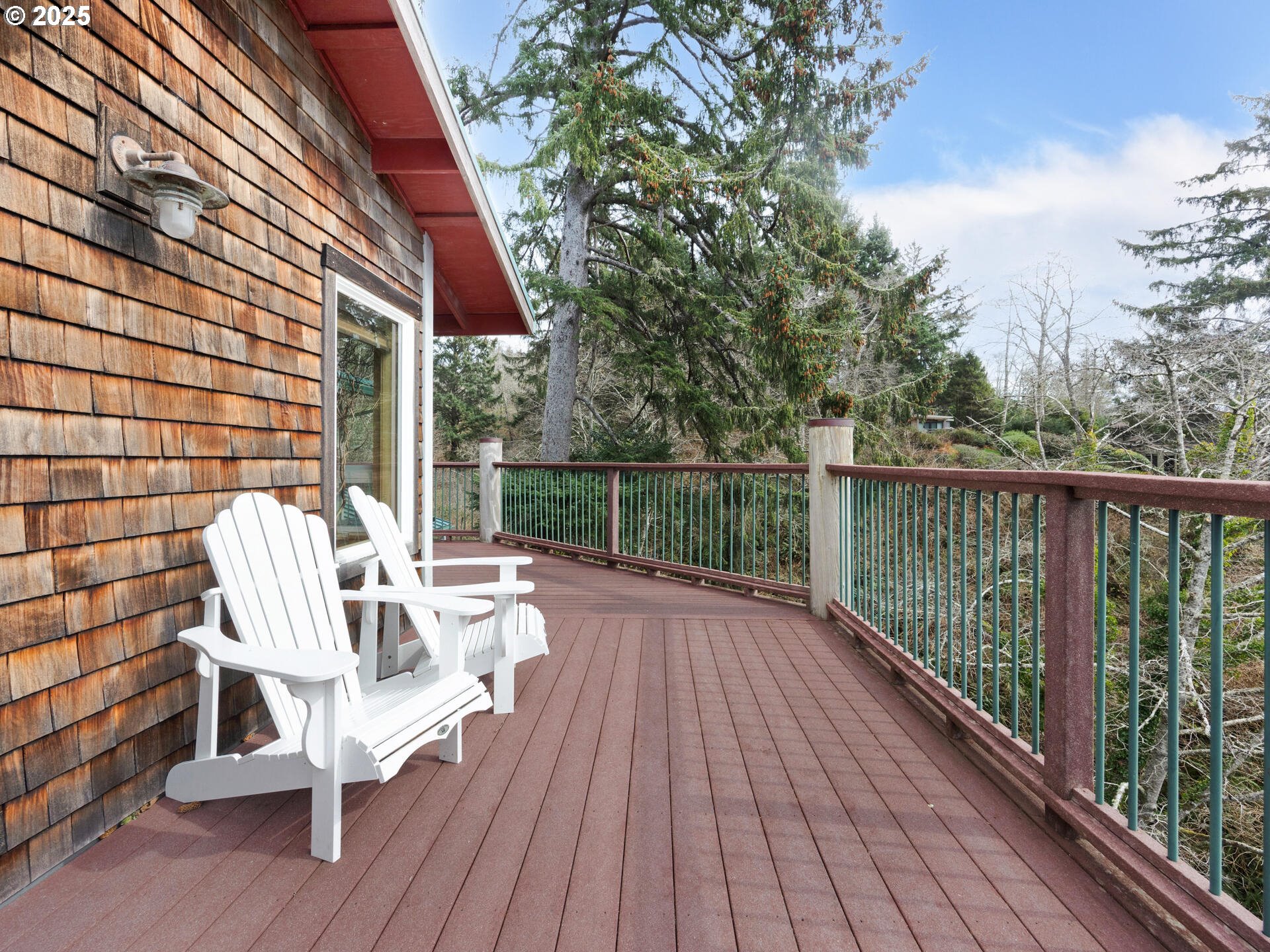 8435 Treasure Rocks Road Nehalem, OR 97131 - Photo 21 of 41 a view of balcony with wooden floor and outdoor seating