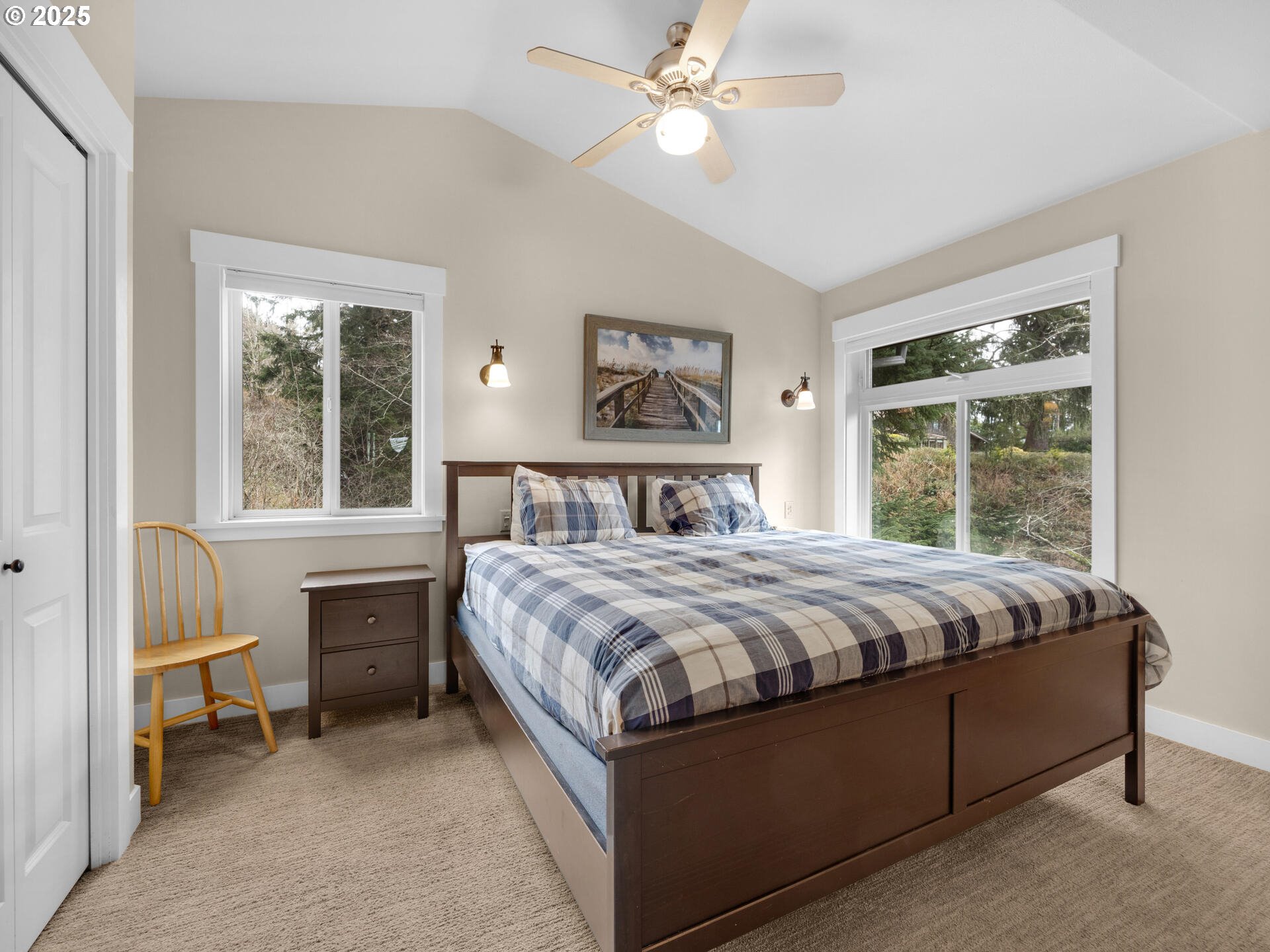 8435 Treasure Rocks Road Nehalem, OR 97131 - Photo 23 of 41 a bedroom with a bed and a window