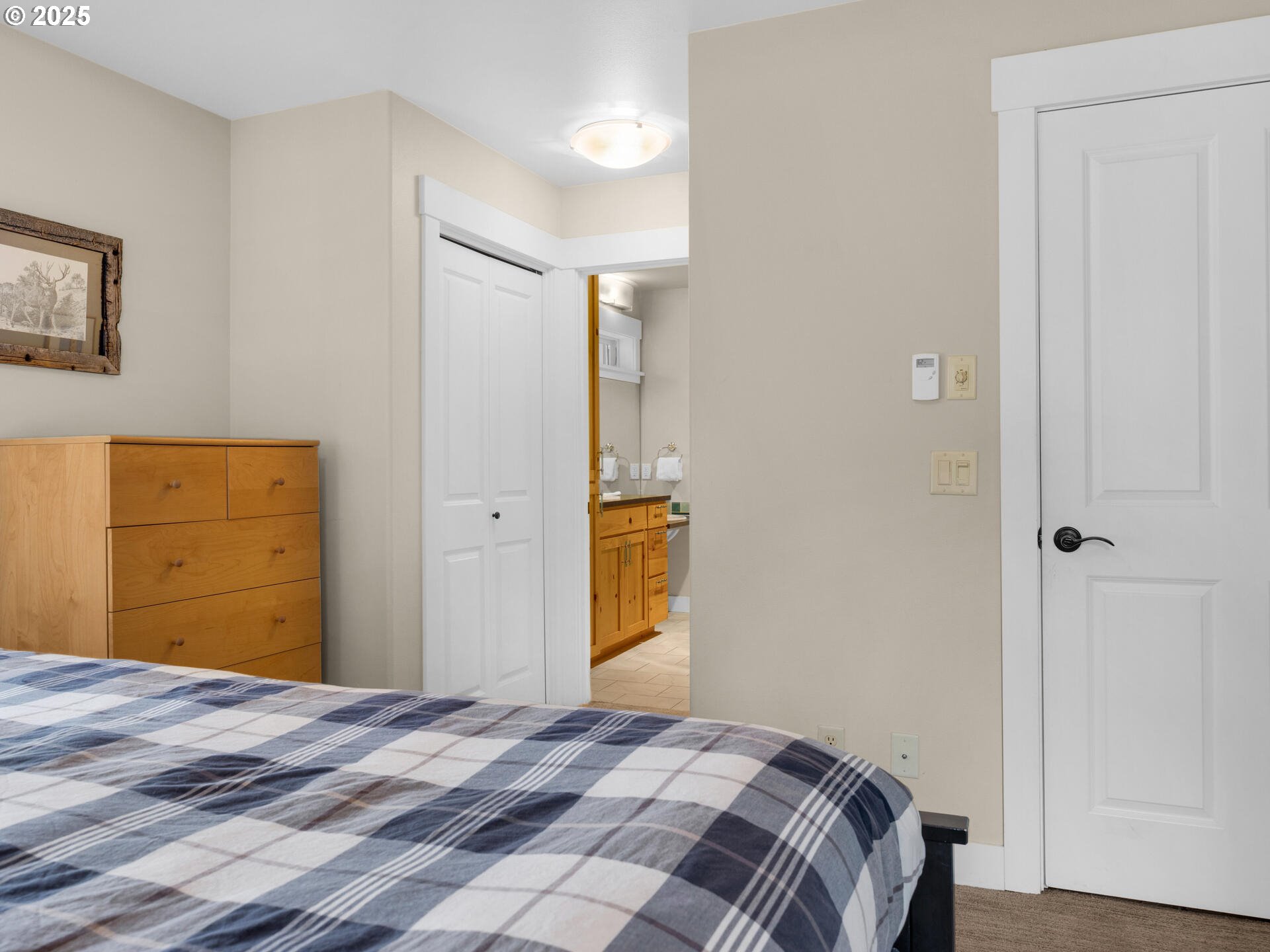 8435 Treasure Rocks Road Nehalem, OR 97131 - Photo 24 of 41 a bedroom with a bed and a cabinets