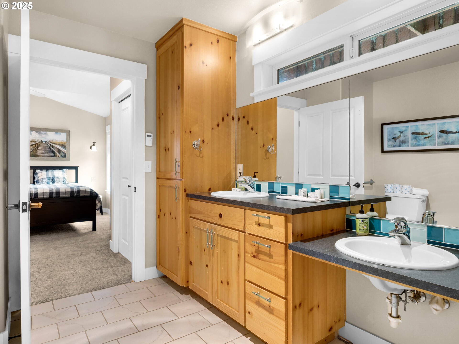 8435 Treasure Rocks Road Nehalem, OR 97131 - Photo 25 of 41 a bathroom with a sink a toilet and a mirror
