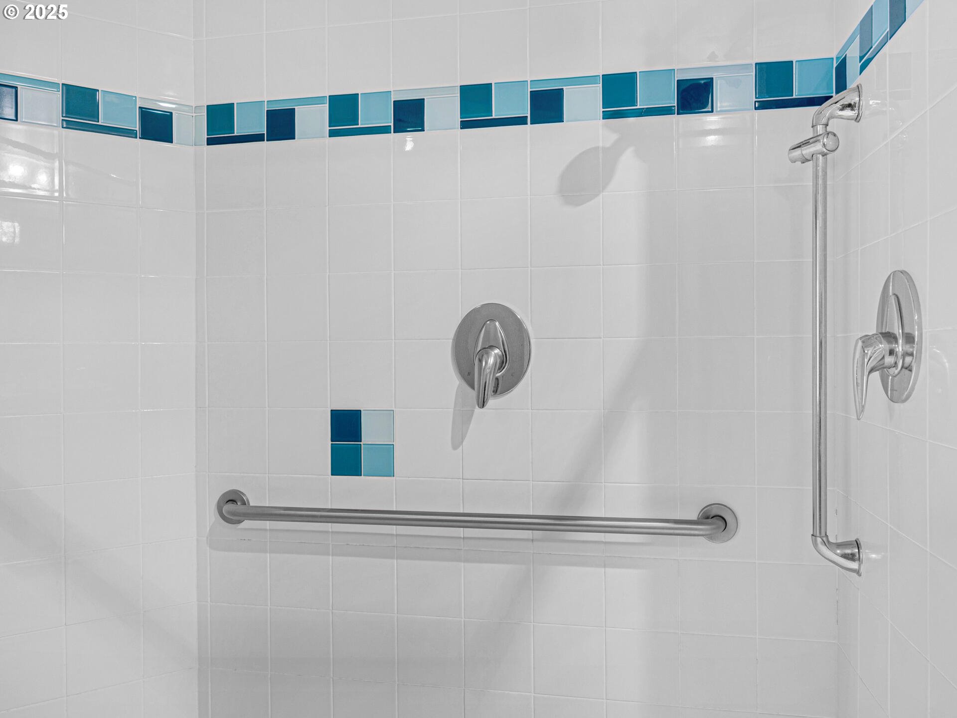 8435 Treasure Rocks Road Nehalem, OR 97131 - Photo 26 of 41 a bathroom with a shower and a mirror