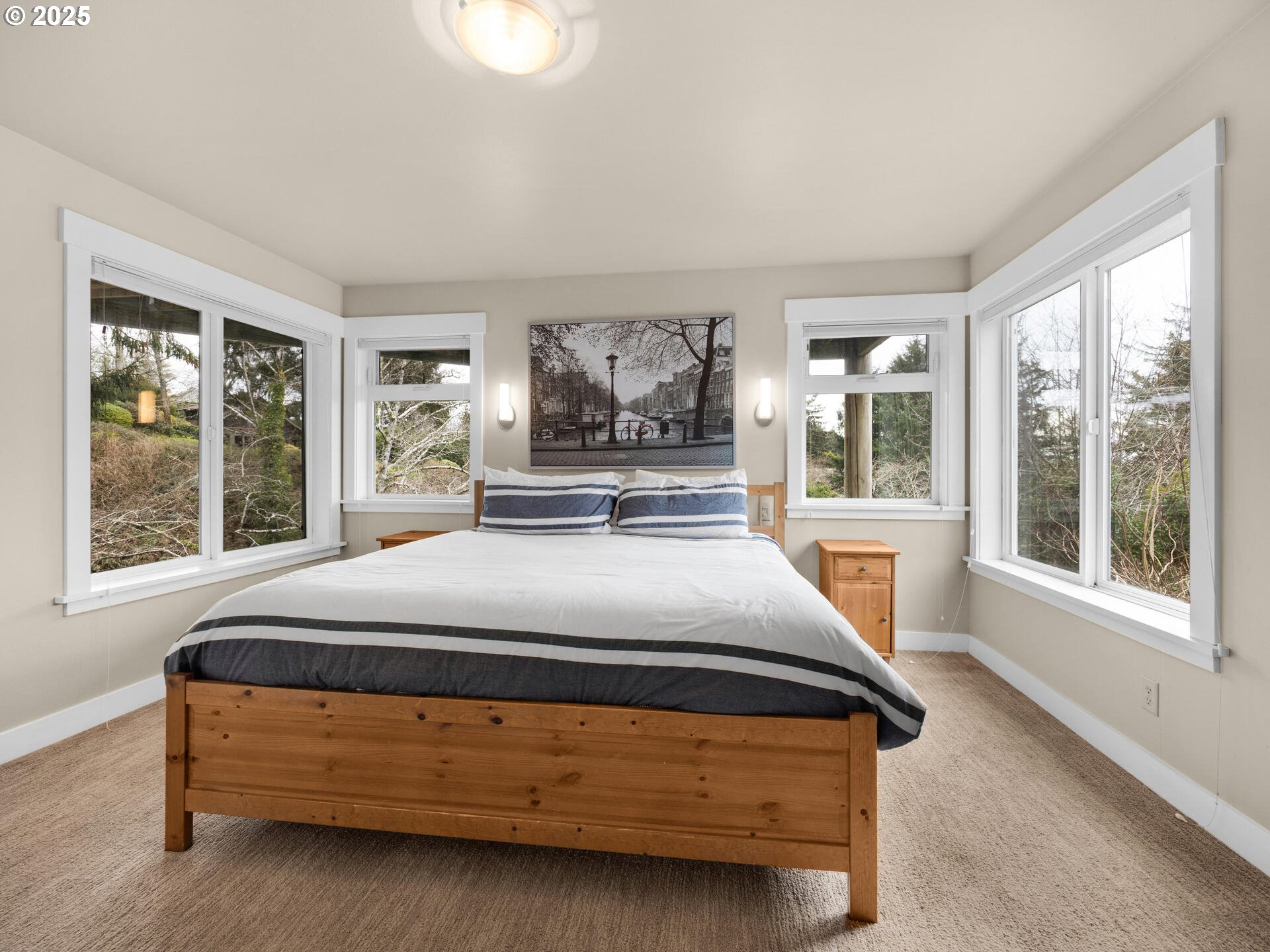 8435 Treasure Rocks Road Nehalem, OR 97131 - Photo 28 of 41 a bedroom with a bed chair and window