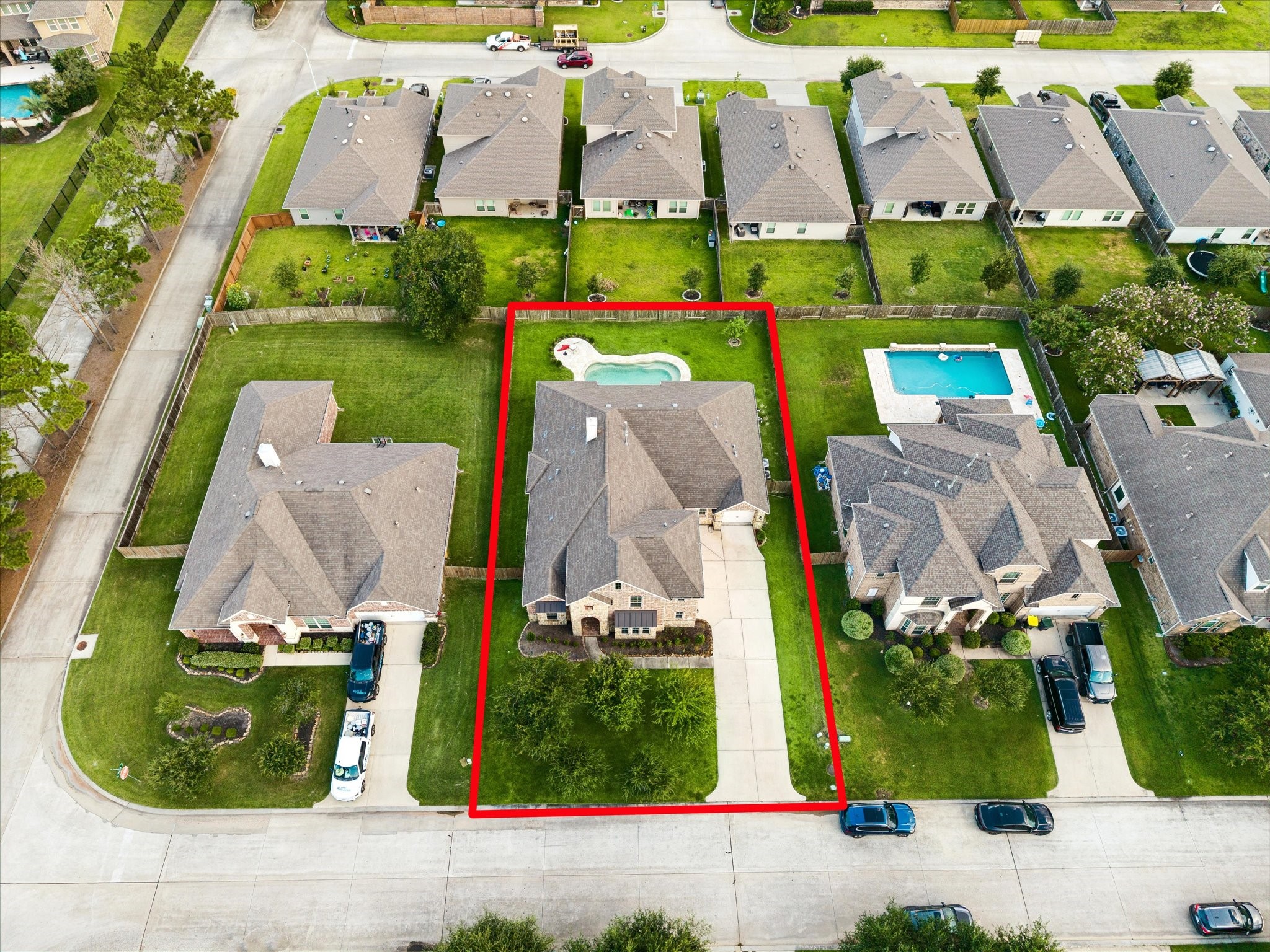 3306 Explorer Way Conroe, TX 77301 - Photo 2 of 35 Extended driveway, saltwater pool and plenty of green space.