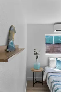 a bedroom with a bed and window