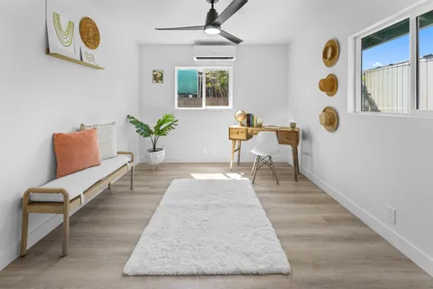 a living room with furniture and window