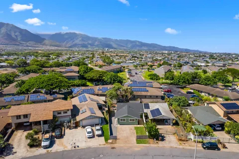 an aerial view of residential houses with outdoor space