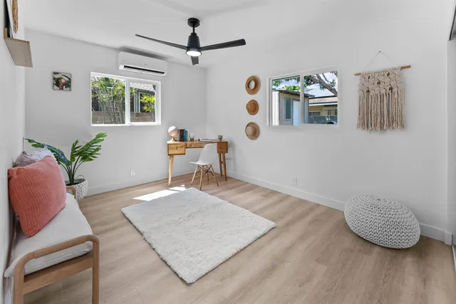 a living room with furniture and window