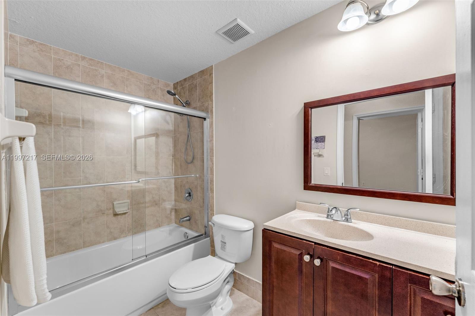 10012 Northwest 7th Street, Unit 206 Miami, FL 33172 - Photo 21 of 35 a bathroom with a sink toilet and shower