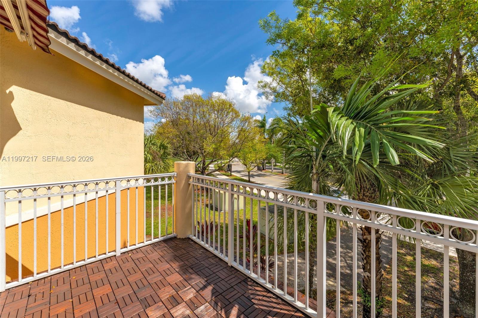 10012 Northwest 7th Street, Unit 206 Miami, FL 33172 - Photo 24 of 35 a view of a balcony with wooden floor