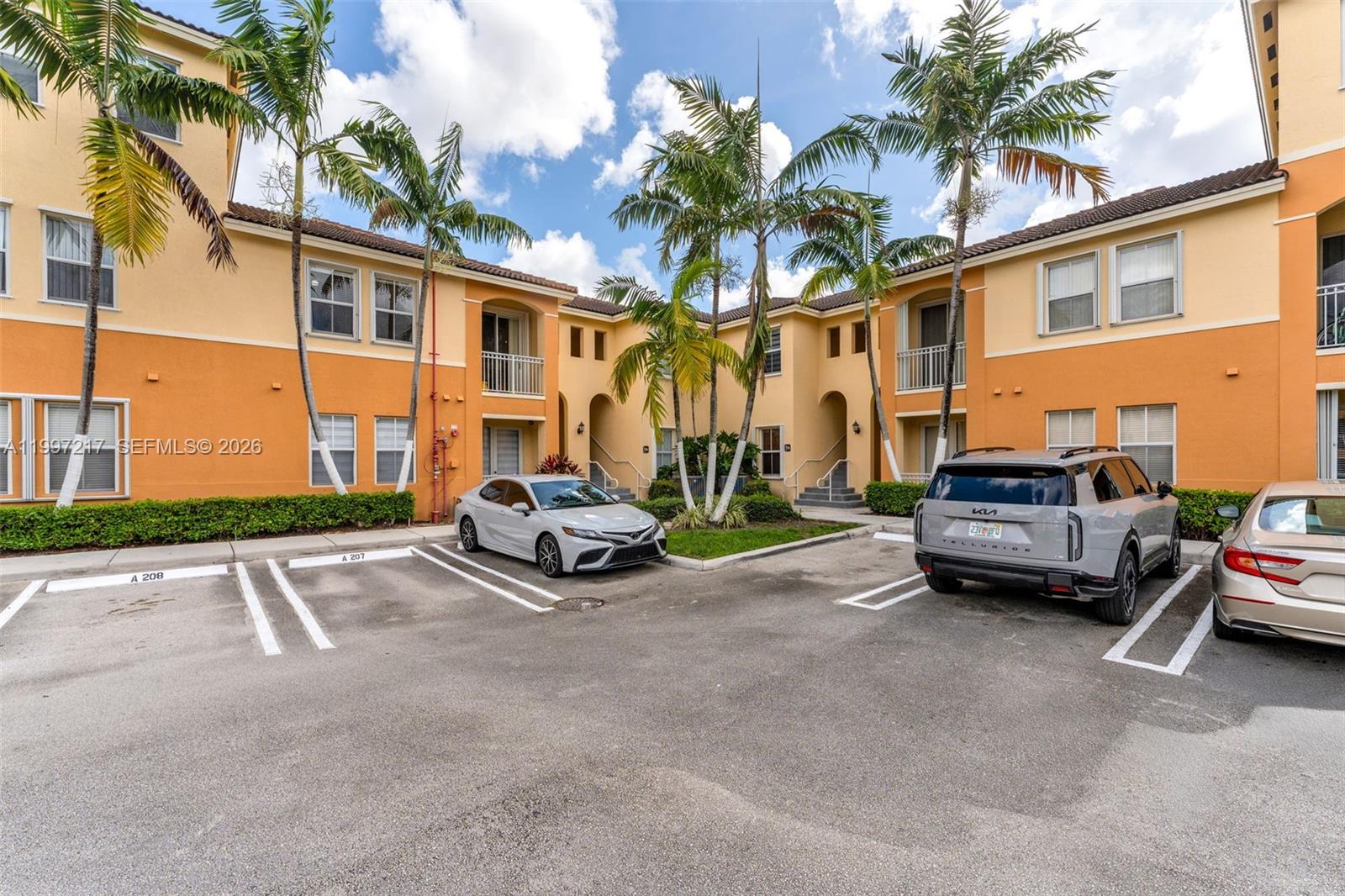 10012 Northwest 7th Street, Unit 206 Miami, FL 33172 - Photo 26 of 35 a car parked in front of a house