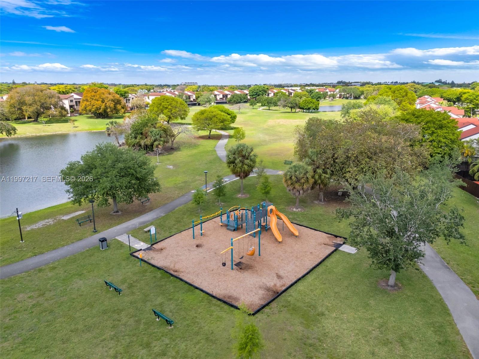 10012 Northwest 7th Street, Unit 206 Miami, FL 33172 - Photo 28 of 35 a view of a lake from a yard