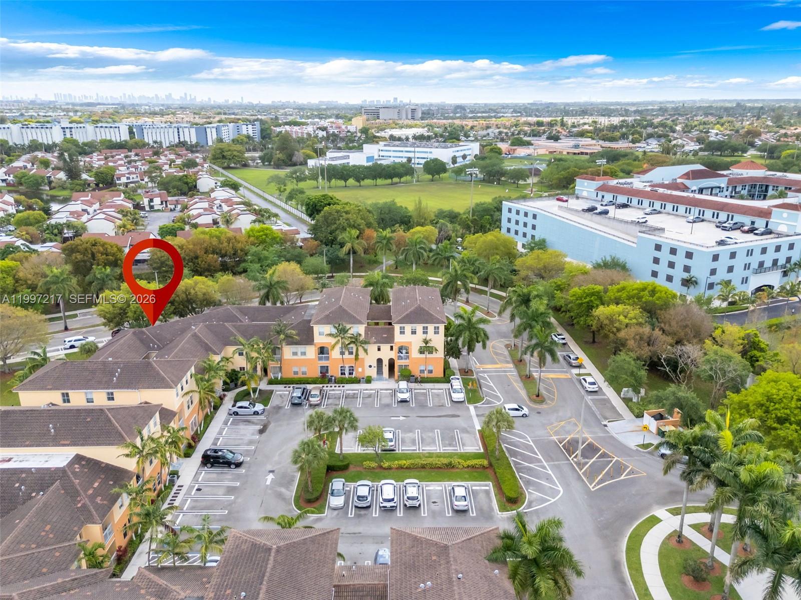 10012 Northwest 7th Street, Unit 206 Miami, FL 33172 - Photo 29 of 35 an aerial view of a city with lots of residential buildings ocean and mountain view in back