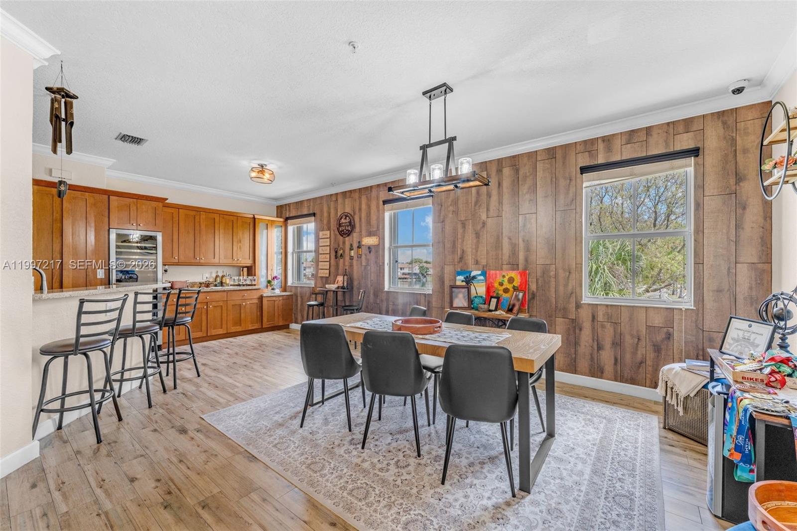 10012 Northwest 7th Street, Unit 206 Miami, FL 33172 - Photo 3 of 35 a view of a dining room with furniture window and wooden floor
