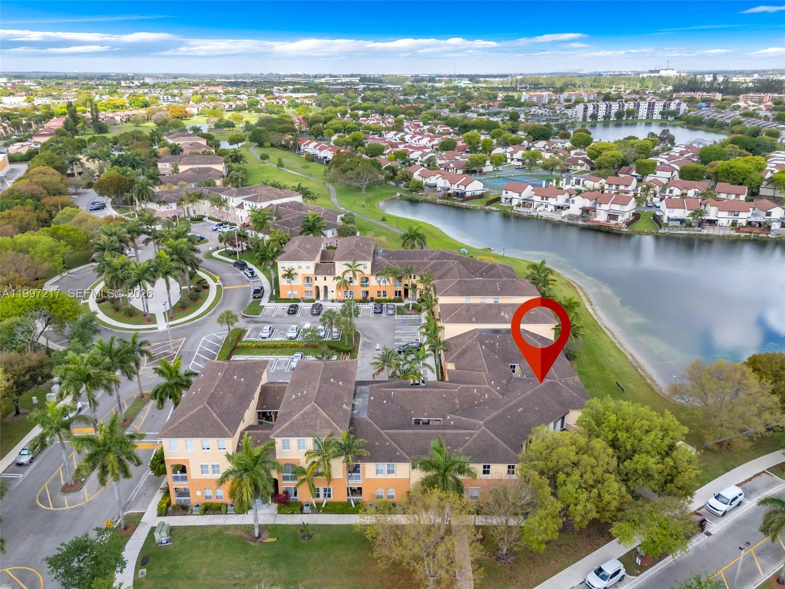 10012 Northwest 7th Street, Unit 206 Miami, FL 33172 - Photo 32 of 35 an aerial view of residential houses with outdoor space and swimming pool