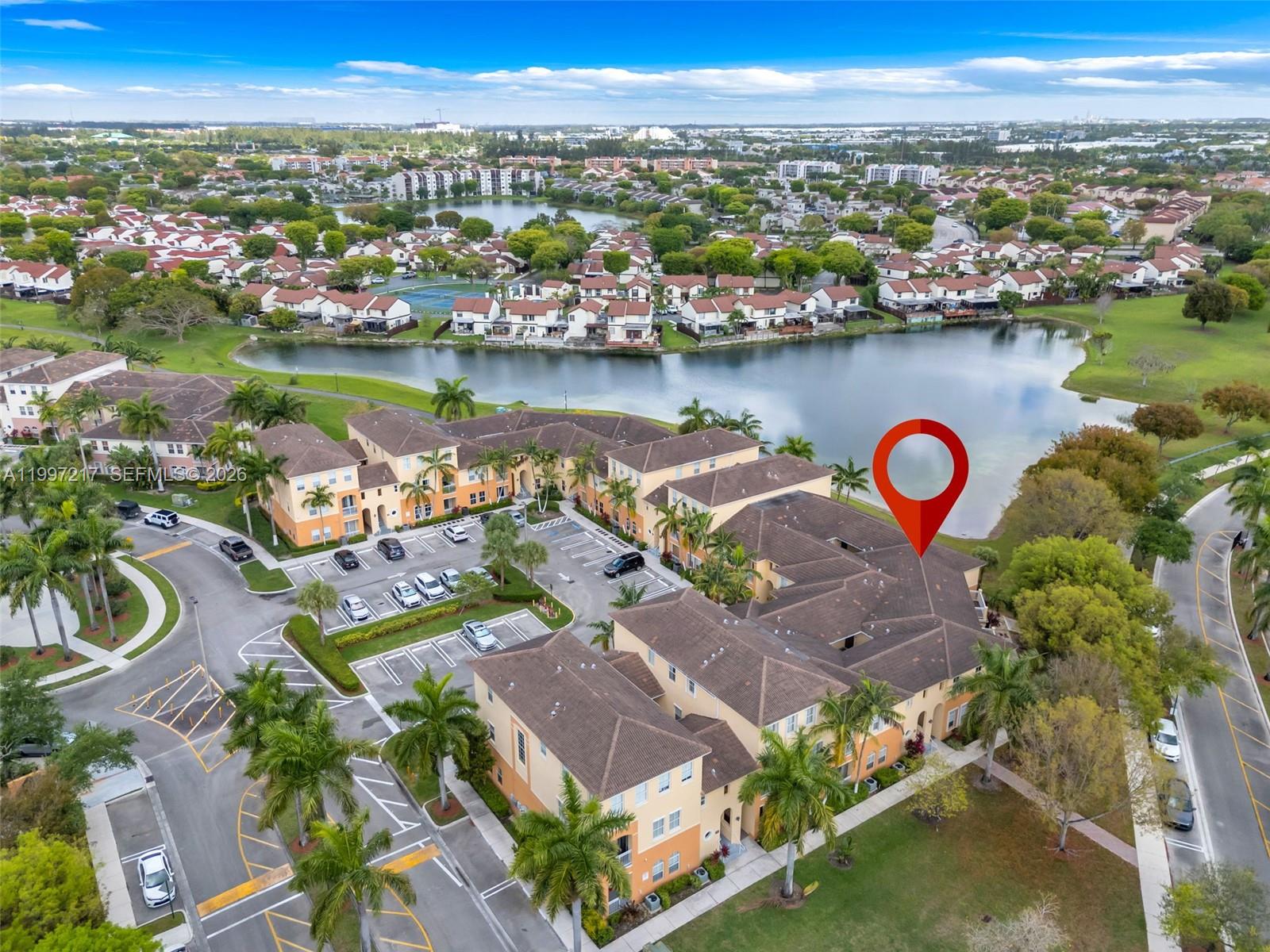 10012 Northwest 7th Street, Unit 206 Miami, FL 33172 - Photo 4 of 35 an aerial view of a house with outdoor space and lake view