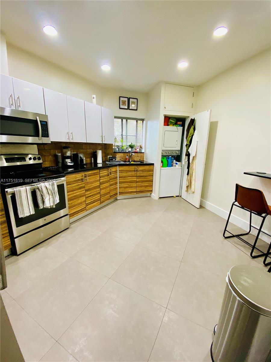 200 Azure Way Miami Springs, FL 33166 - Photo 39 of 54 a large living room with furniture and a flat screen tv