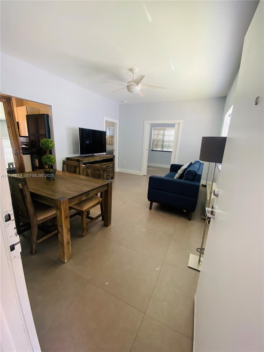 200 Azure Way Miami Springs, FL 33166 - Photo 43 of 54 a view of a livingroom with furniture and a flat screen tv