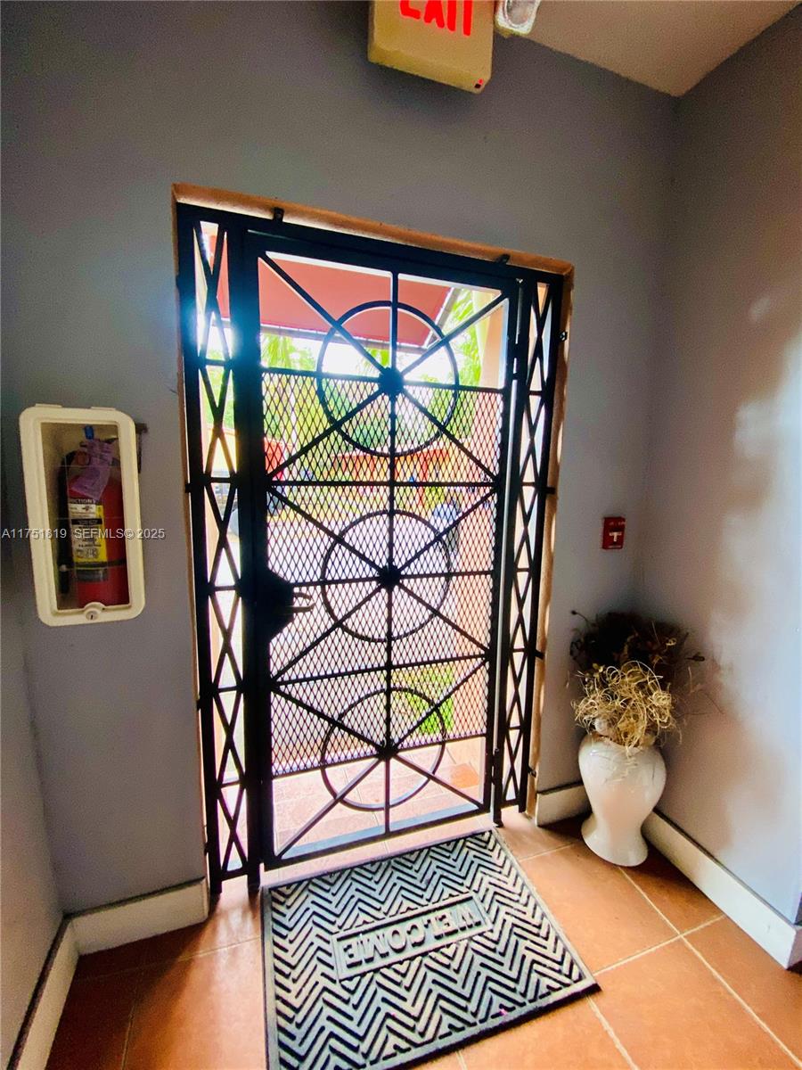 200 Azure Way Miami Springs, FL 33166 - Photo 6 of 54 a bedroom with furniture and a potted plant