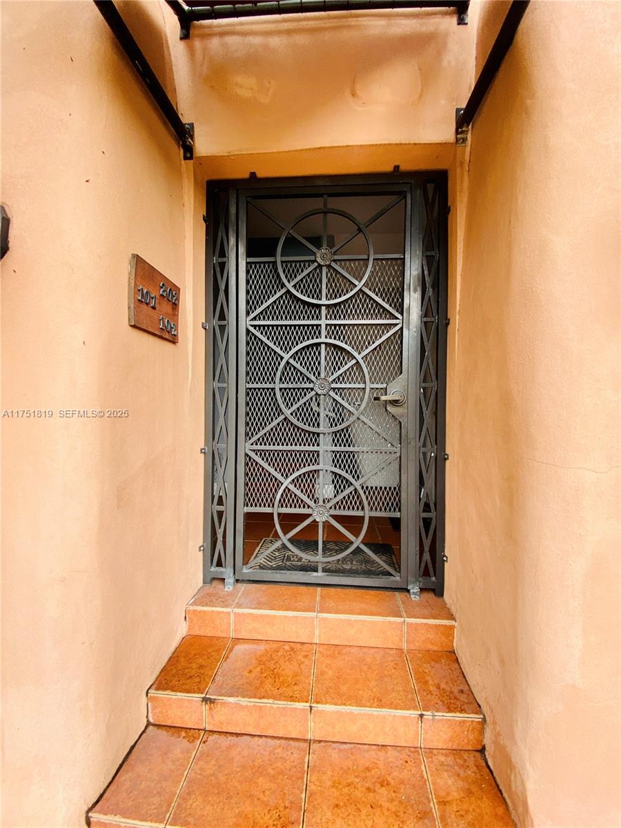 200 Azure Way Miami Springs, FL 33166 - Photo 9 of 54 a view of front door of a house