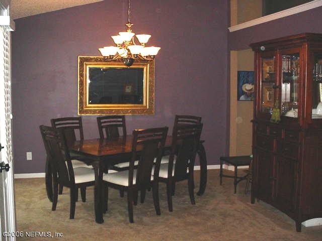 3547 Whisper Creek Boulevard Middleburg, FL 32068 - Photo 3 of 10 a view of a dining room with furniture