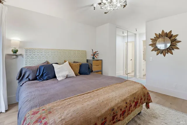 a bedroom with a bed and a fireplace